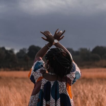 woman standing in the middle of wheat field