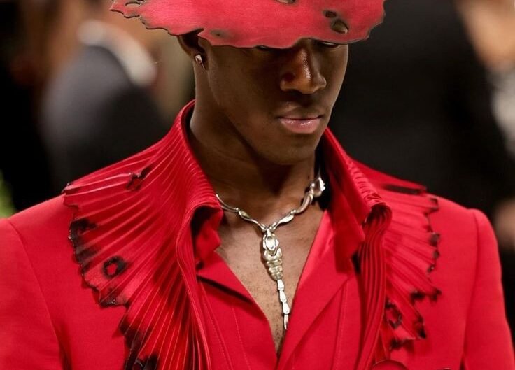 alt="Wisdom Kaye IMG model runway shot"