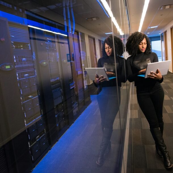 woman in black top using Surface laptop