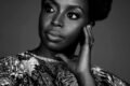 alt="Chimamanda Ngozi Adichie giving The Danger of a Single Story TED Talk"
