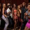 Energetic group of friends dancing and enjoying a lively night out in New York City.
