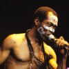 Fela Kuti singing into a microphone, pictured for the Zombie 50th anniversary reissue story