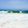 Waves break on Lekki Beach in Lagos, a December 2026 destination for Detty December visitors