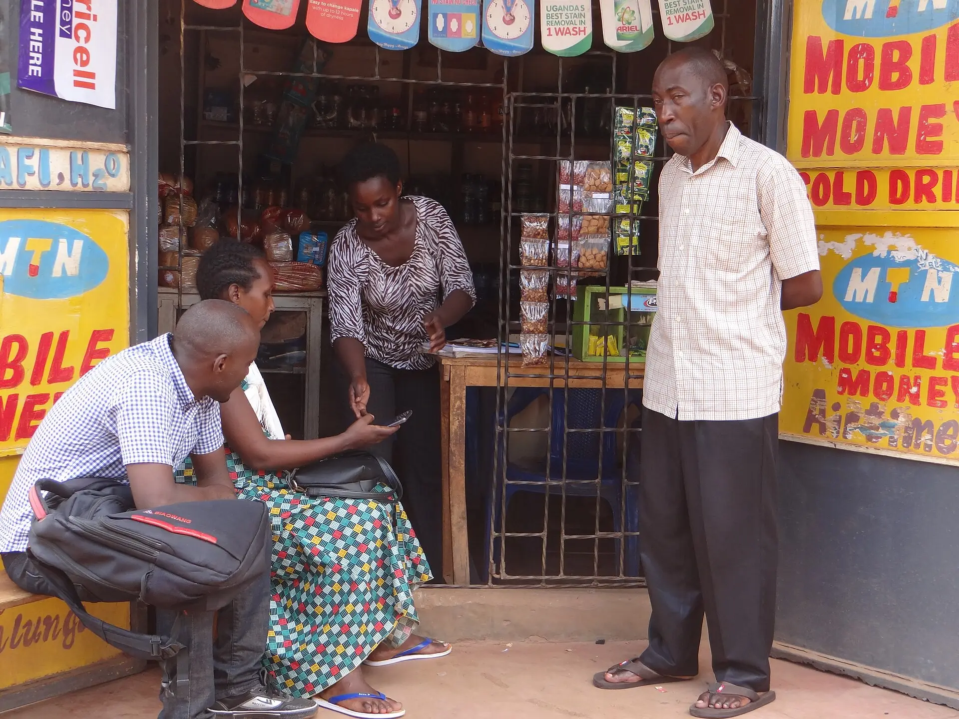 A mobile money outlet that shows how remittance costs reach local recipients