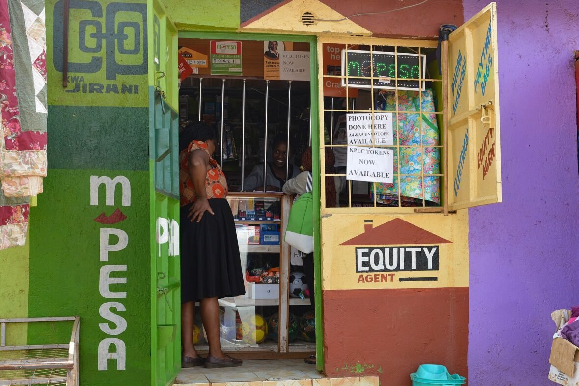 A Nairobi M-PESA and Equity agent shop where families collect remittance money, a place where remittance fees are felt