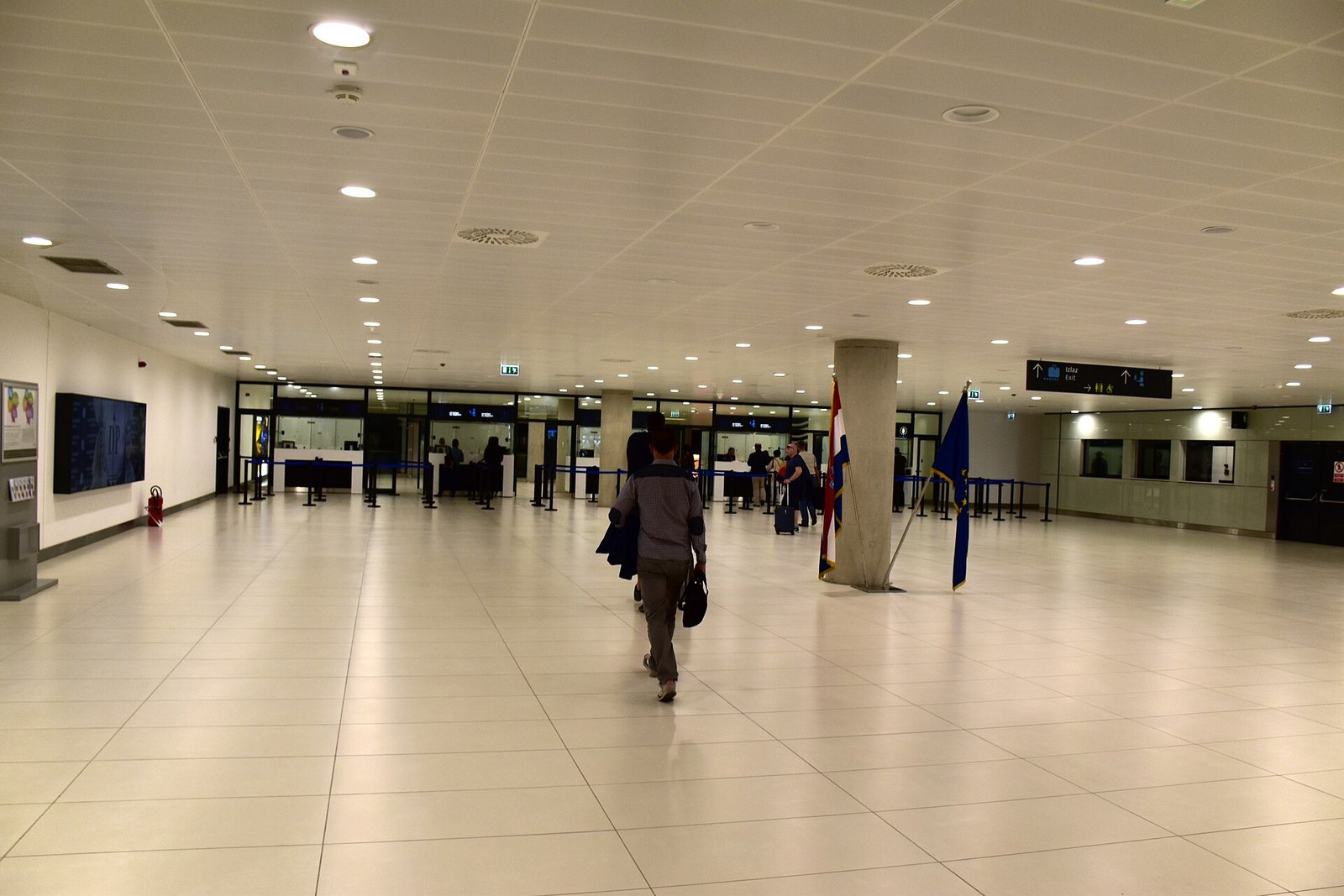 Airport passport control hall where travelers show visas and passports