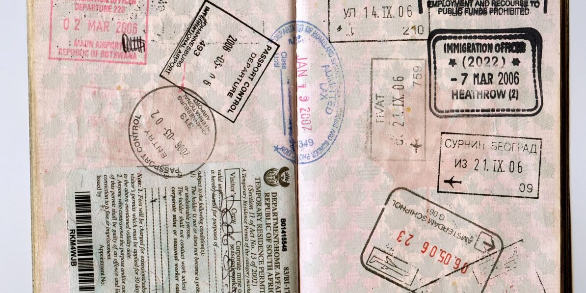 Passport pages with visa and immigration stamps, a reminder to check US entry limits before you apply